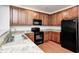 Modern kitchen with stainless steel appliances, granite countertops and wooden cabinets at 5677 Brownstone Dr # 5677, Indianapolis, IN 46220
