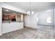 Open concept living room with view of kitchen and plenty of natural light at 5677 Brownstone Dr # 5677, Indianapolis, IN 46220