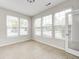 Bright sun room with tile flooring and many windows letting in natural light at 5677 Brownstone Dr # 5677, Indianapolis, IN 46220
