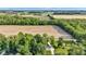Aerial view overlooking lush green trees and vast farmland at 5710 W 650 N, Thorntown, IN 46071