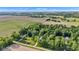 Scenic aerial view of a home surrounded by lush greenery and open fields at 5710 W 650 N, Thorntown, IN 46071
