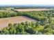 Aerial view overlooking lush green trees and vast farmland at 5710 W 650 N, Thorntown, IN 46071