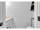 Bathroom with white cabinets, marble countertop and toilet at 5710 W 650 N, Thorntown, IN 46071