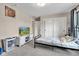 Comfortable bedroom offering natural light, closet, laundry basket and entertainment center at 5710 W 650 N, Thorntown, IN 46071