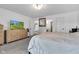 Spacious bedroom with a bed, dresser, and a view into the bathroom, creating a luxurious Primary suite at 5710 W 650 N, Thorntown, IN 46071