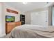 Comfortable bedroom with a view of the front yard, dresser, and sliding door closet at 5710 W 650 N, Thorntown, IN 46071