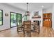 Bright dining room with fireplace, wood table and chairs, and backyard access at 5710 W 650 N, Thorntown, IN 46071