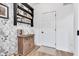 A nicely decorated entryway with hardwood floors, a cabinet and wallpaper at 5710 W 650 N, Thorntown, IN 46071
