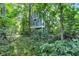 A-frame home in the woods with stairs leading to the elevated entrance at 5710 W 650 N, Thorntown, IN 46071
