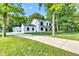 Beautiful two-story home with long driveway, garage, and lush greenery providing a private and picturesque setting at 5710 W 650 N, Thorntown, IN 46071