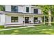 Charming front porch with rocking chairs and decorative plants, creating a welcoming entrance at 5710 W 650 N, Thorntown, IN 46071