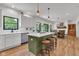 Bright kitchen features a center island with stool seating and stainless steel appliances at 5710 W 650 N, Thorntown, IN 46071