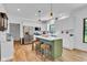Bright kitchen featuring stainless appliances, central island with seating, and modern lighting at 5710 W 650 N, Thorntown, IN 46071