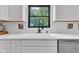 Close-up view of kitchen sink with black faucet and countertop at 5710 W 650 N, Thorntown, IN 46071