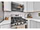 Modern kitchen with stainless steel appliances and white cabinetry at 5710 W 650 N, Thorntown, IN 46071
