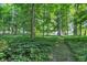 Scenic view of the wooded land with a glimpse of the house in the background at 5710 W 650 N, Thorntown, IN 46071