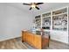 Home office featuring a vintage desk, custom built-in shelving, and ample storage for an organized workspace at 5710 W 650 N, Thorntown, IN 46071