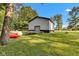 Exterior view of the outbuilding with trampoline and watercraft on the lawn at 5710 W 650 N, Thorntown, IN 46071