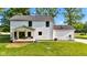 The rear exterior of this home features a covered porch and a well manicured lawn at 5710 W 650 N, Thorntown, IN 46071