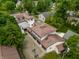 Aerial view of a large home featuring a spacious backyard, garages, and brick driveway at 5805 Forest Ln, Indianapolis, IN 46220