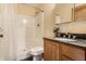 Bathroom featuring tiled floors, granite countertop vanity, and shower-tub combination at 5805 Forest Ln, Indianapolis, IN 46220