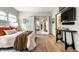 Bright bedroom featuring access to an ensuite bath and modern decor at 5805 Forest Ln, Indianapolis, IN 46220