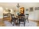 A dining room with hard wood floors, a vintage rug, and a chandelier at 5805 Forest Ln, Indianapolis, IN 46220
