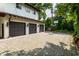 Spacious stone driveway and three-car garage, perfect for parking and outdoor activities at 5805 Forest Ln, Indianapolis, IN 46220