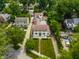 Overhead view showcasing the home's landscaping, long driveway, and architectural design at 5805 Forest Ln, Indianapolis, IN 46220