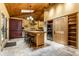 Spacious kitchen with skylights, an island with seating, and stainless steel appliances at 5805 Forest Ln, Indianapolis, IN 46220