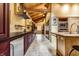 A galley kitchen featuring wood-paneled ceilings and custom cabinetry with stone floors at 5805 Forest Ln, Indianapolis, IN 46220