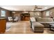 Spacious living area with hardwood floors, comfortable sofa, and ample lighting at 5805 Forest Ln, Indianapolis, IN 46220