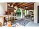 Covered patio featuring an outdoor kitchen with a grill, pizza oven and dining area at 5805 Forest Ln, Indianapolis, IN 46220