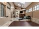 Inviting sunroom with a hot tub, skylights, and access to the backyard, perfect for relaxation and entertainment at 5805 Forest Ln, Indianapolis, IN 46220