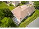 Aerial view of the home showcasing the deck, fenced backyard, mature trees, and exterior of home at 6483 Royal Oakland Dr, Indianapolis, IN 46236