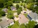 Aerial view showcases neighborhood homes, a golf course, mature trees and beautiful landscaping at 6483 Royal Oakland Dr, Indianapolis, IN 46236