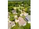 Aerial view showcases neighborhood homes, a golf course, mature trees and beautiful landscaping at 6483 Royal Oakland Dr, Indianapolis, IN 46236