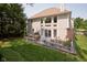 Lovely deck with a dining table, a grill, bench seating, and a view of the large rear windows at 6483 Royal Oakland Dr, Indianapolis, IN 46236