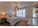 Bedroom with a large window, carpet and a modern light fixture above the bed at 6483 Royal Oakland Dr, Indianapolis, IN 46236