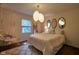 Bedroom with a cozy hanging chair, three wall mirrors and a large window at 6483 Royal Oakland Dr, Indianapolis, IN 46236