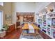 Dining area features a dining table with wood floor and built in bookshelves at 6483 Royal Oakland Dr, Indianapolis, IN 46236