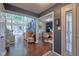 Open entryway with view into living room and office space with wood floors and neutral paint at 6483 Royal Oakland Dr, Indianapolis, IN 46236