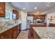 Spacious kitchen featuring granite counters, stainless steel appliances, and white subway tile at 6483 Royal Oakland Dr, Indianapolis, IN 46236