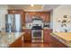 Updated kitchen featuring granite countertops, stainless steel appliances, and ample storage space at 6483 Royal Oakland Dr, Indianapolis, IN 46236