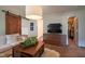 Open living area with a couch, television, and an open doorway to a walk-in closet at 6483 Royal Oakland Dr, Indianapolis, IN 46236