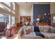 Cozy living room features a comfortable sofa, hardwood floors, and plenty of natural light at 6483 Royal Oakland Dr, Indianapolis, IN 46236