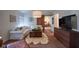 Cozy living room with a white sofa, a wooden coffee table, and a barn door to the bedroom at 6483 Royal Oakland Dr, Indianapolis, IN 46236