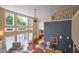 Bright living room boasts large windows, hardwood floors, and an open floor plan at 6483 Royal Oakland Dr, Indianapolis, IN 46236