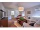 Bright living room with comfortable seating, modern entertainment center, and natural light at 6483 Royal Oakland Dr, Indianapolis, IN 46236