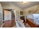 Office features wood floors, neutral paint, decorative shelving, and glass paneled french doors at 6483 Royal Oakland Dr, Indianapolis, IN 46236